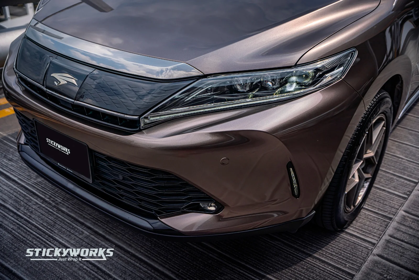 StickyWorks Toyota Harrier car wrap front detail close-up showcasing premium brown vinyl finish and precise installation