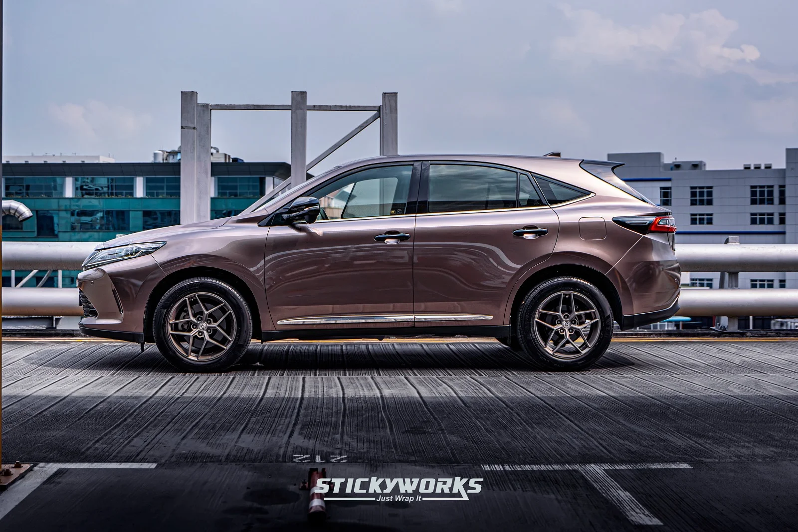 StickyWorks Toyota Harrier front angle on rooftop highlighting high-quality wrap