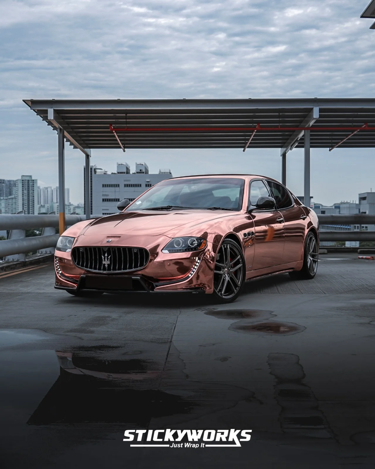 StickyWorks Maserati front angle in rose gold chrome wrap emphasizing aggressive styling and reflective surface