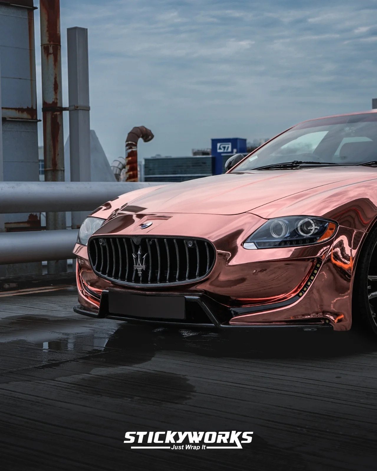 StickyWorks Maserati front grille close-up in rose gold chrome wrap showcasing bold styling and premium detailing