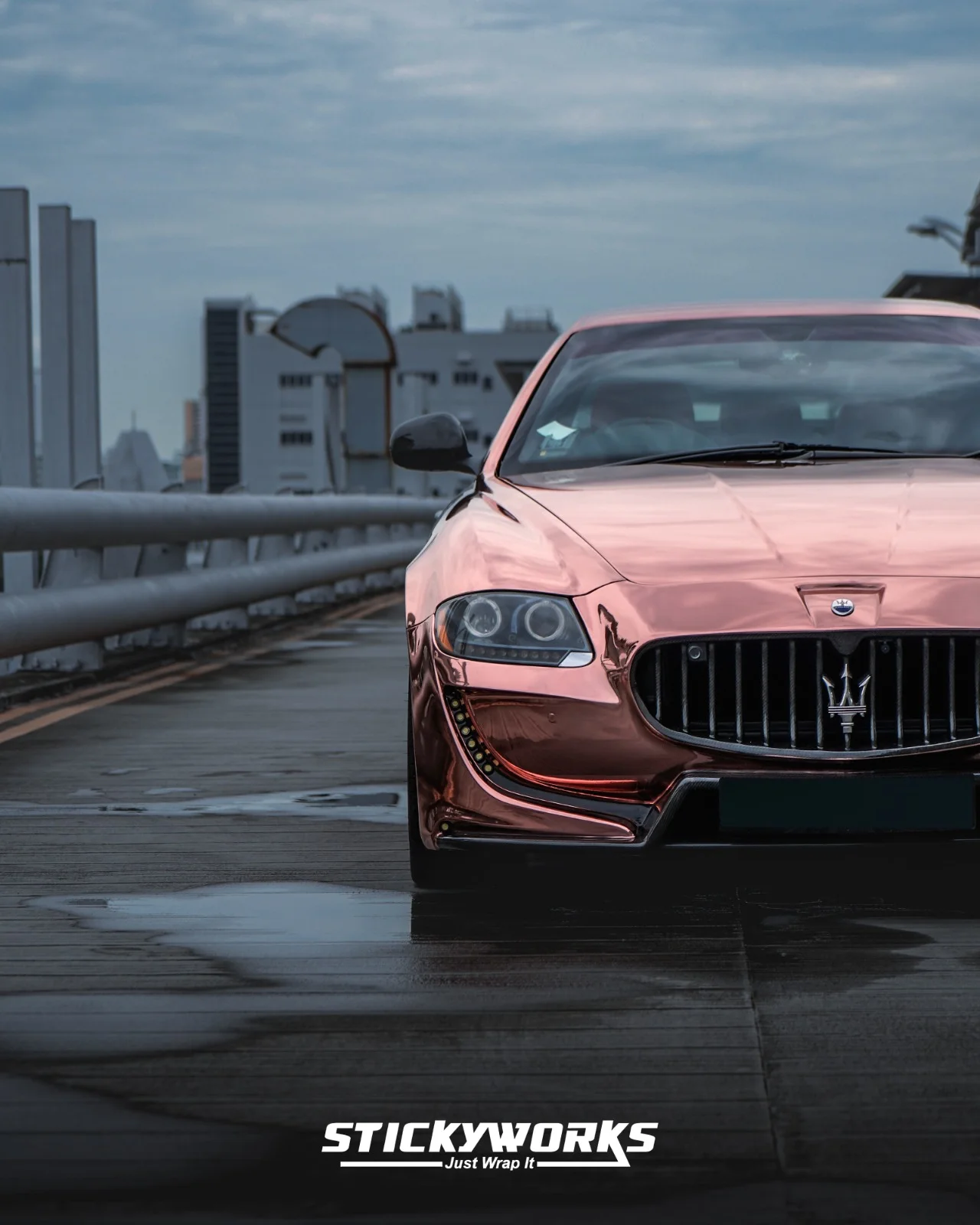 StickyWorks Maserati front symmetry shot in rose gold chrome wrap showcasing bold stance and flawless wrap