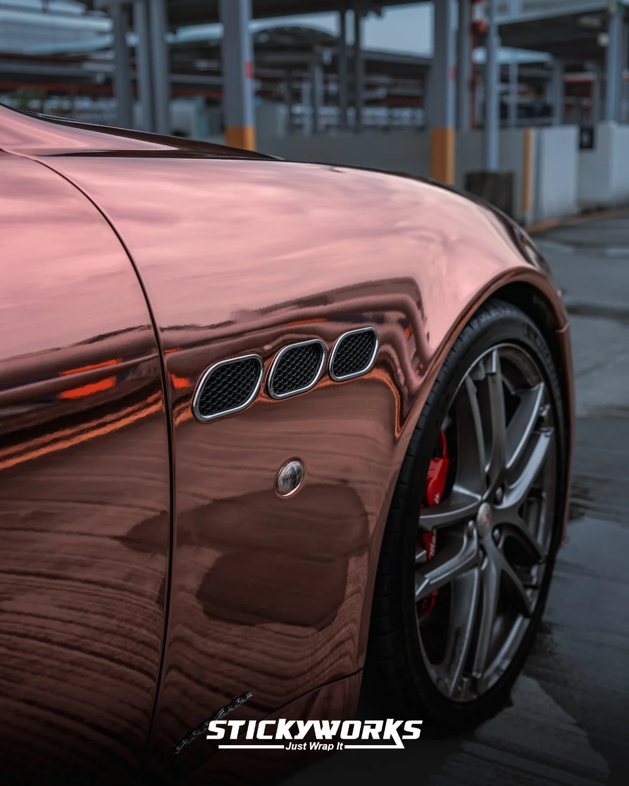 StickyWorks Maserati chrome wrap side detail showing mirror-like reflections and precision installation