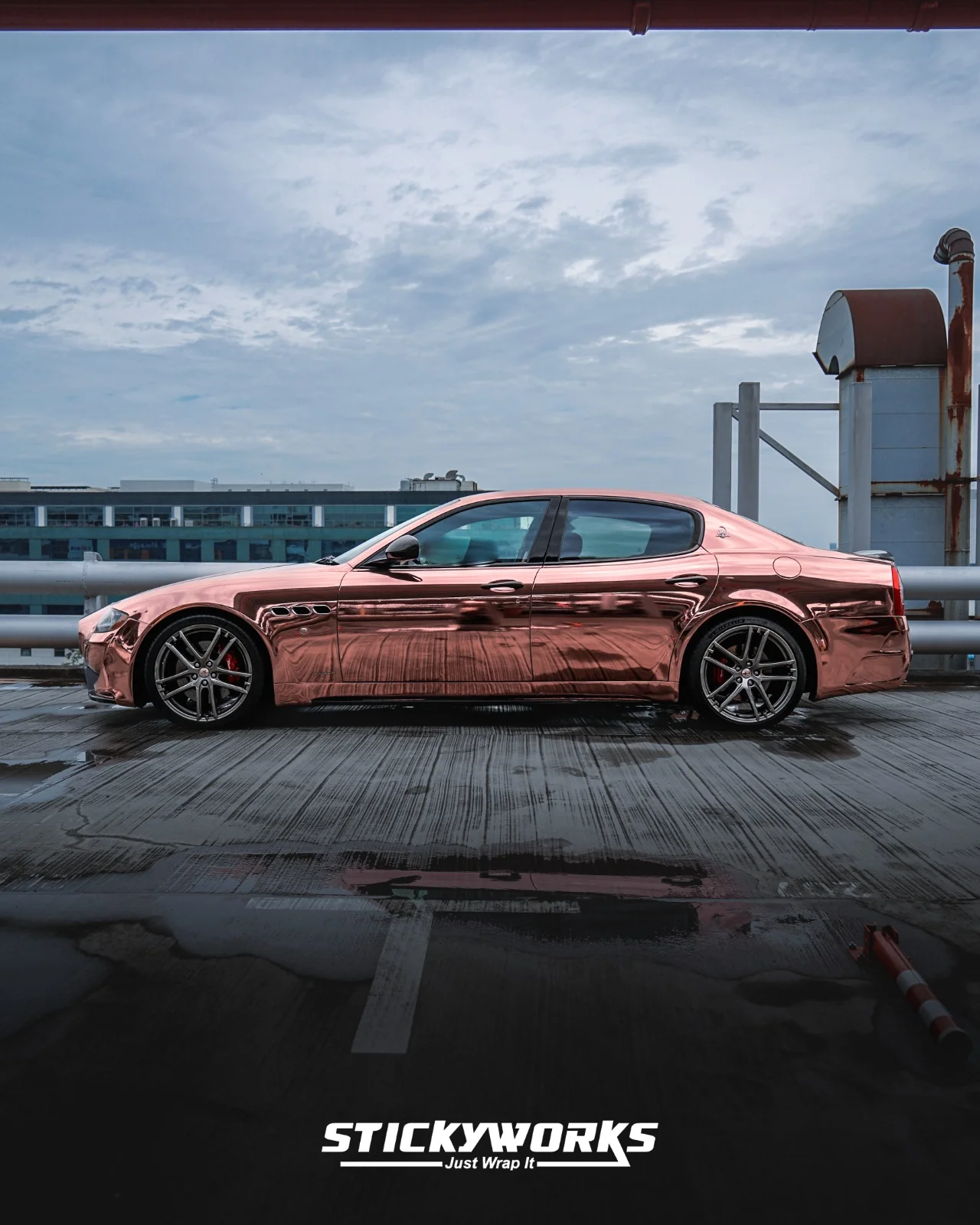 StickyWorks Maserati full side profile in rose gold chrome wrap showing seamless body coverage and mirror finish