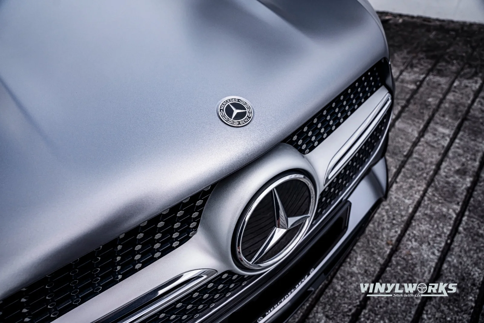 StickyWorks Mercedes front grille close-up with satin grey wrap highlighting detailed vinyl application