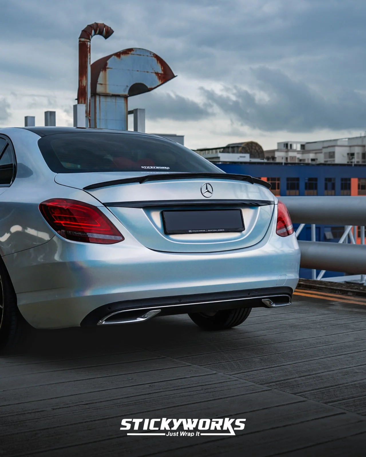 StickyWorks Mercedes rear angle in silver wrap highlighting smooth reflections and professional wrap quality