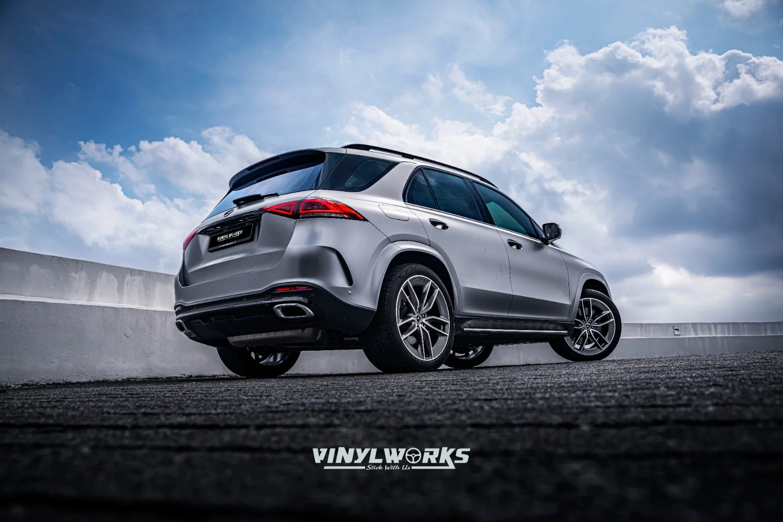StickyWorks Mercedes SUV rear angle with satin grey wrap emphasizing seamless coverage and premium look
