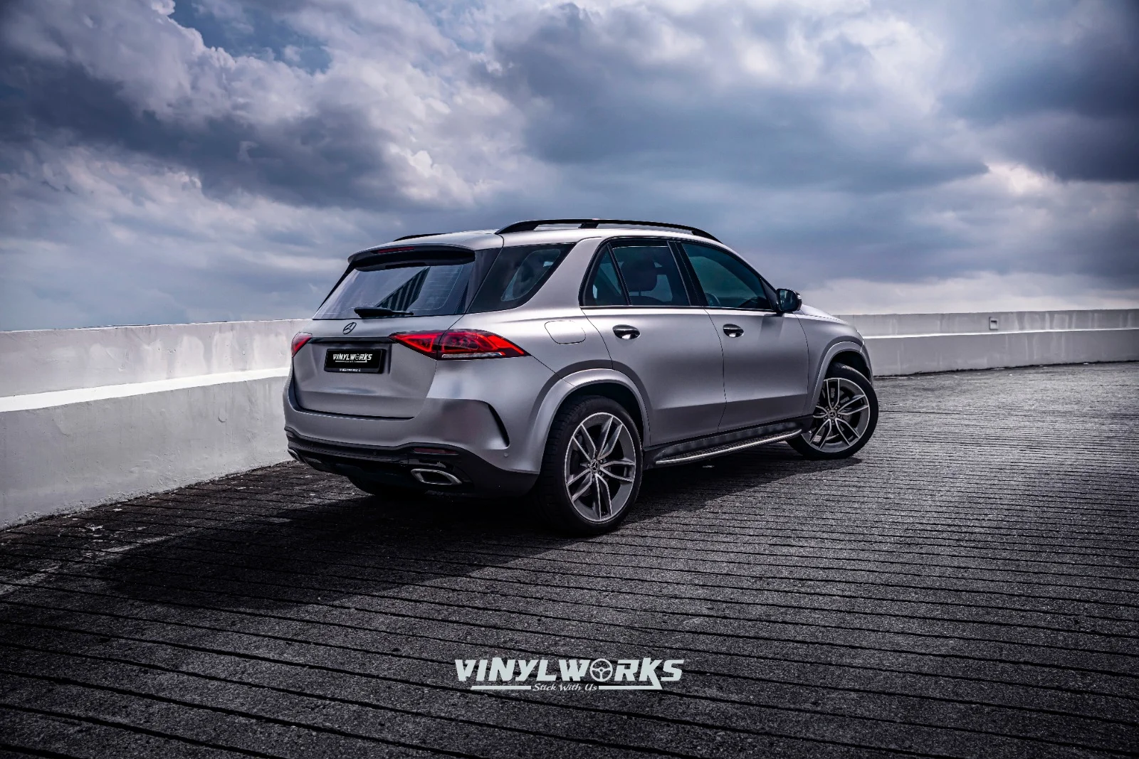 StickyWorks Mercedes SUV rear wide angle shot with satin grey wrap under natural lighting