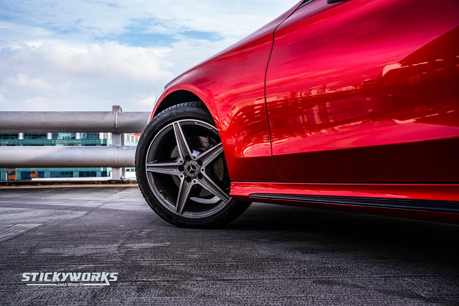 StickyWorks Mercedes wheel detail with gloss red wrap highlighting sporty styling and clean finish