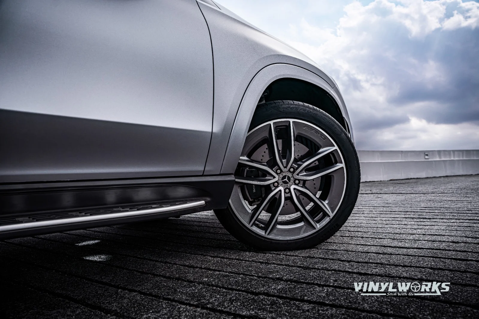 StickyWorks Mercedes SUV wheel detail with satin grey wrap highlighting precision finishing and styling