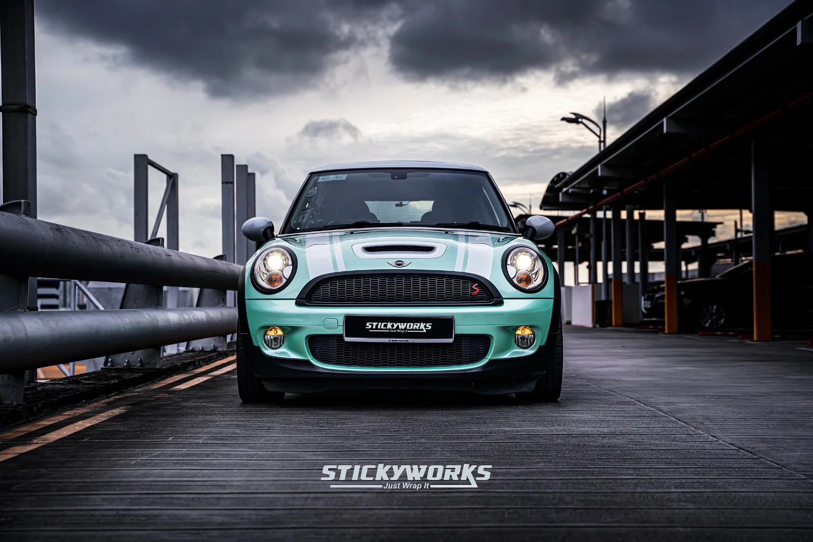 StickyWorks Mini Cooper front view with mint wrap and white stripes showcasing bold and clean finish