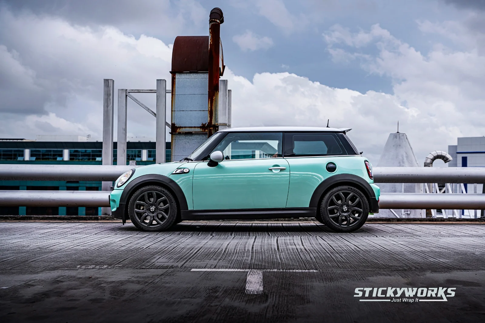StickyWorks Mini Cooper side profile with mint wrap highlighting smooth application and clean lines