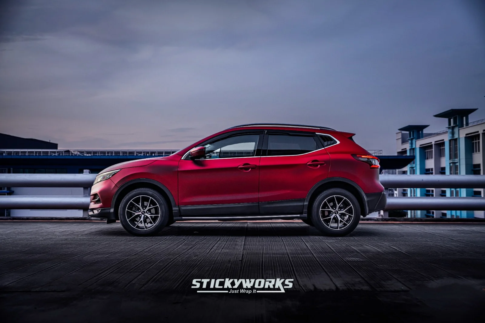 StickyWorks Nissan Qashqai full side profile with red vinyl wrap demonstrating consistent finish and alignment