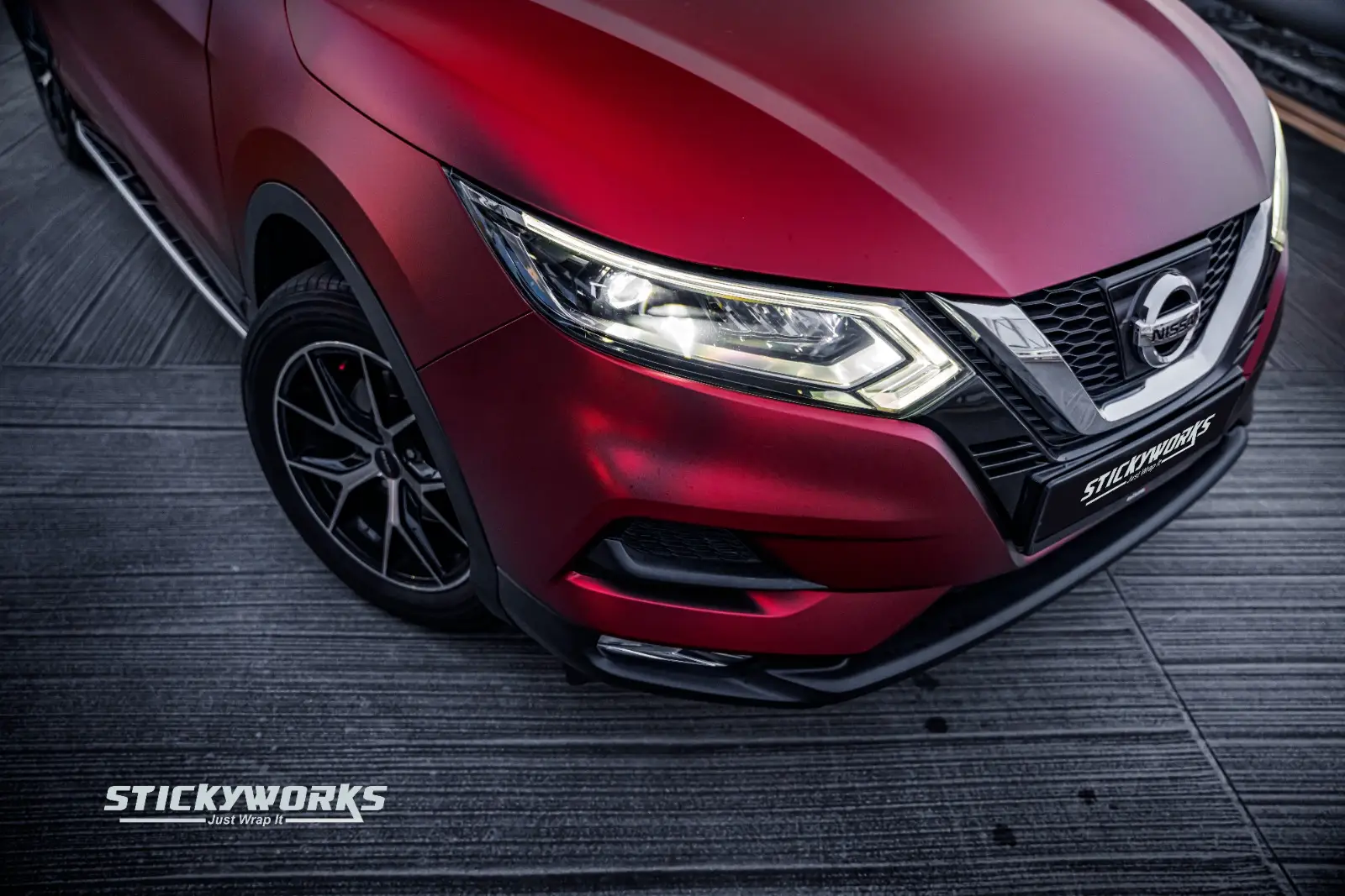 StickyWorks red matte car wrap front close-up showcasing premium vinyl finish and detailing