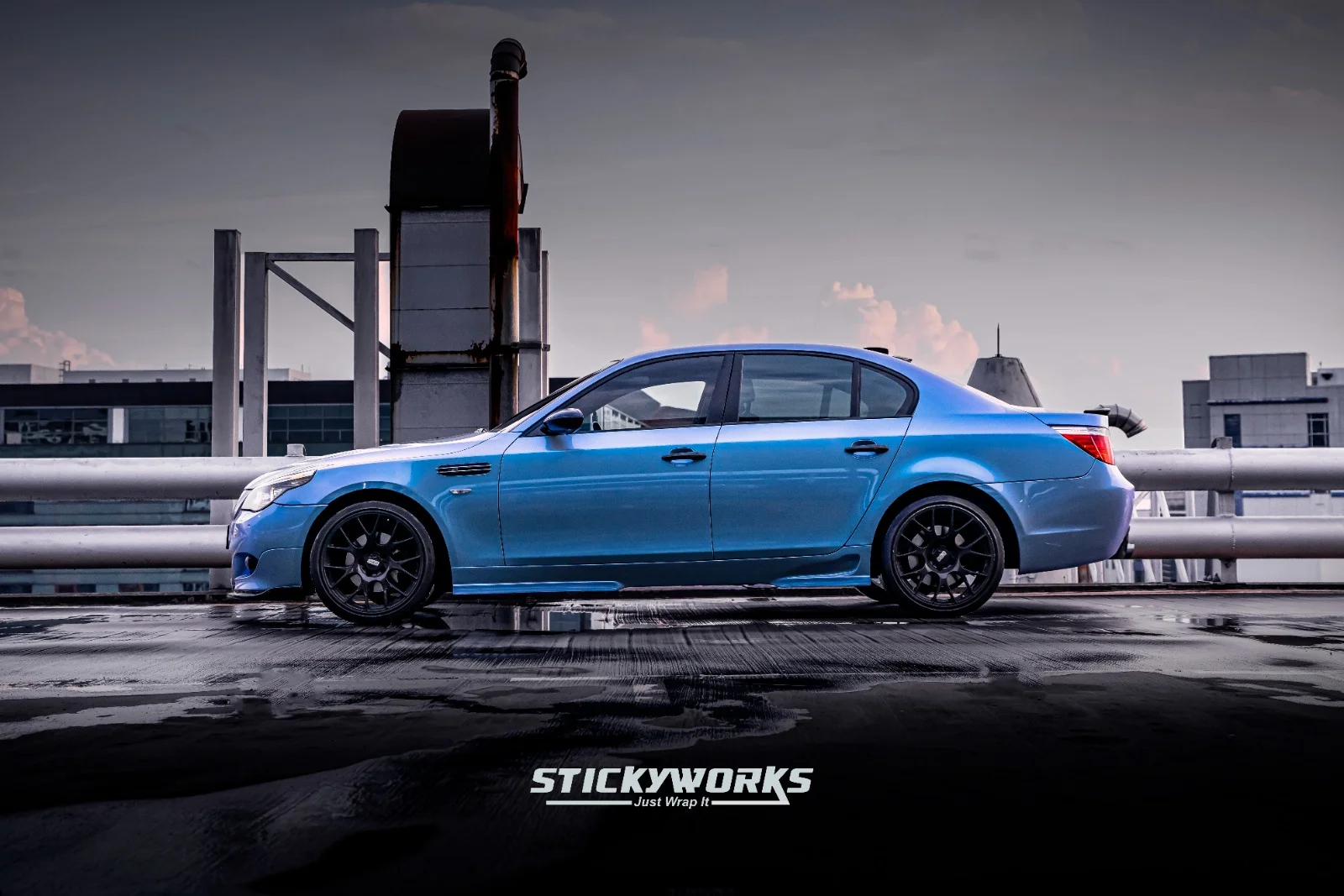 StickyWorks BMW blue wrap side profile highlighting full vehicle transformation and clean installation