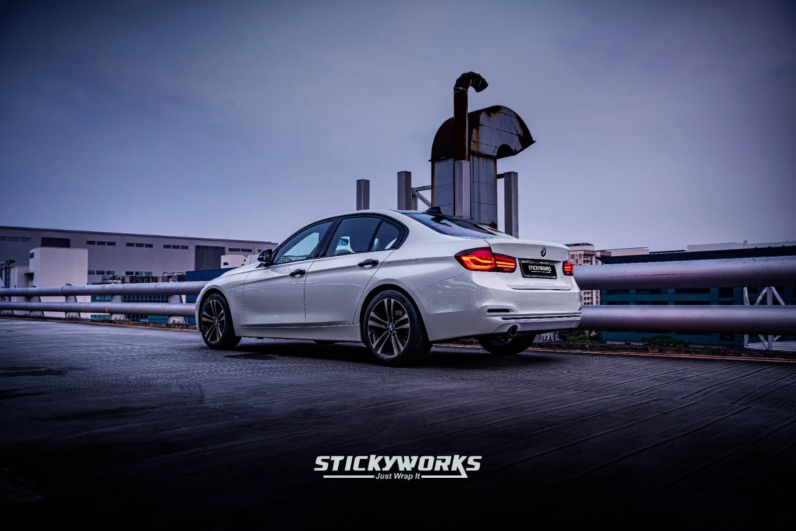 StickyWorks BMW rear wide shot in silver wrap showcasing clean lines and refined luxury finish