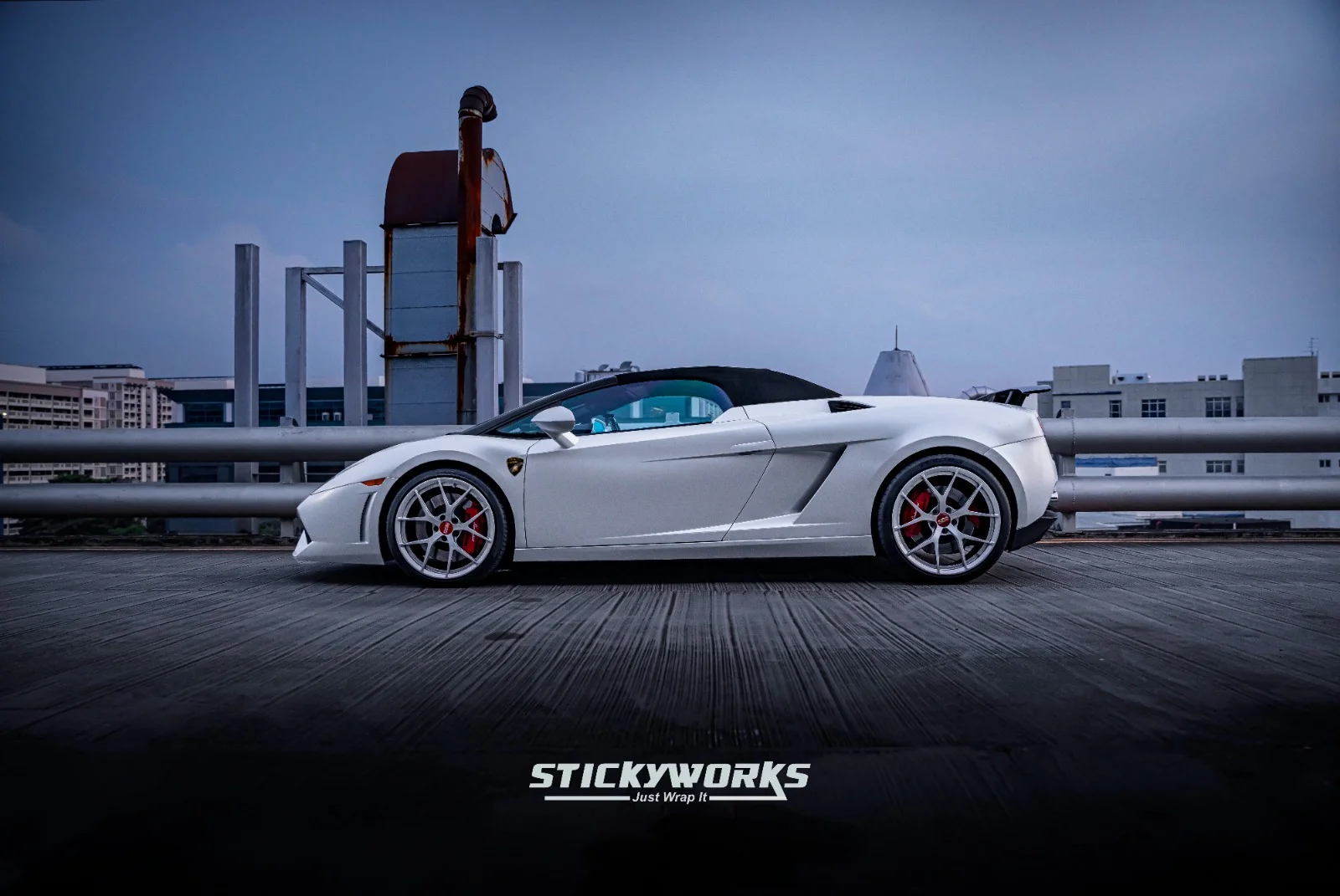 StickyWorks Lamborghini side profile in matte white wrap highlighting sleek silhouette and clean application